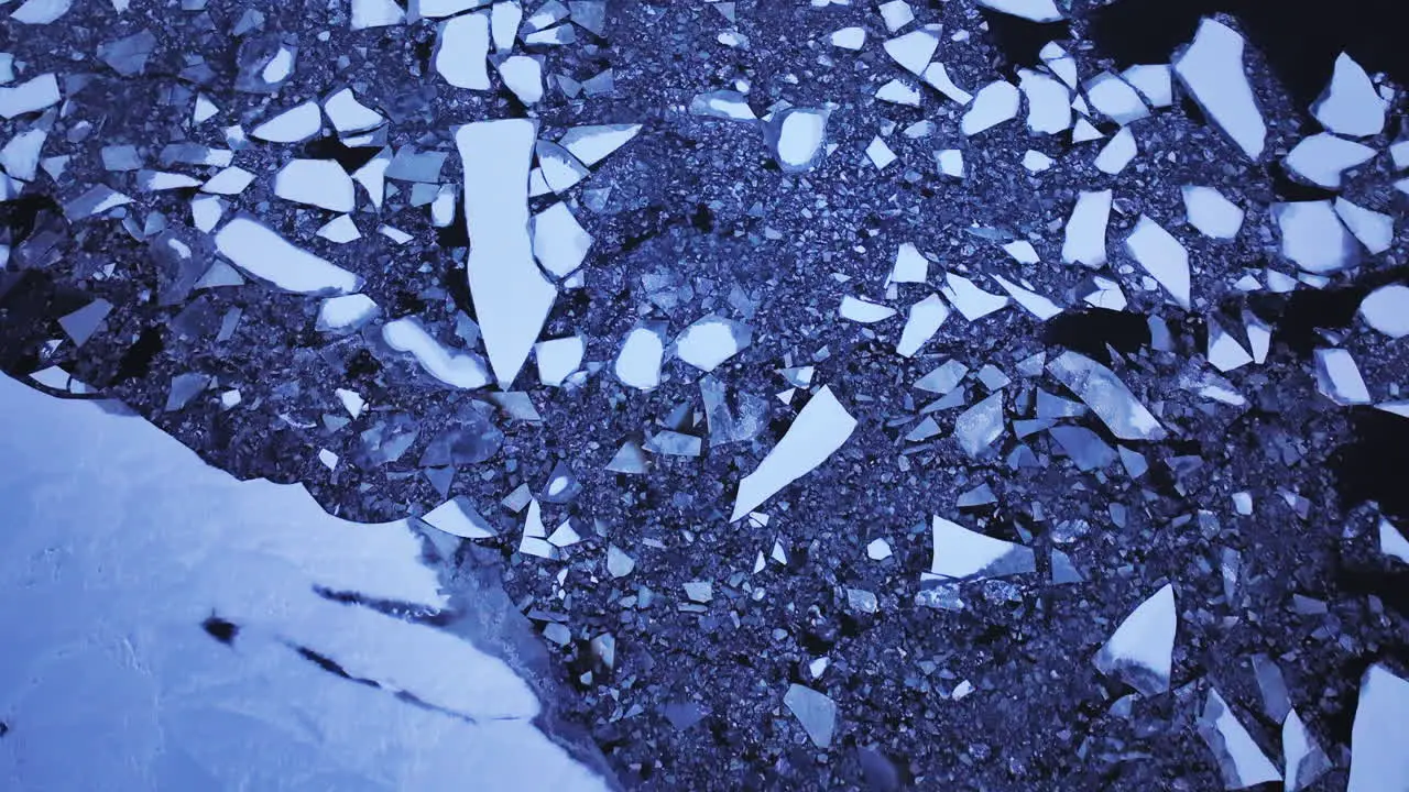 Aerial perspective of massive ice blocks drifting in the water