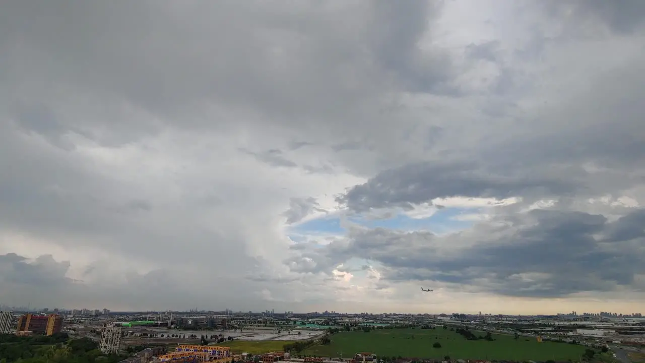  Low fast moving storm clouds sweep across Toronto Ontario Canada Wide angle timelapse