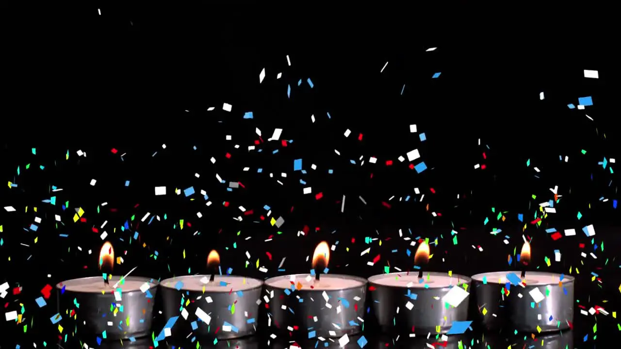 Digital composition ofcolorful confetti falling over burning candles against black background