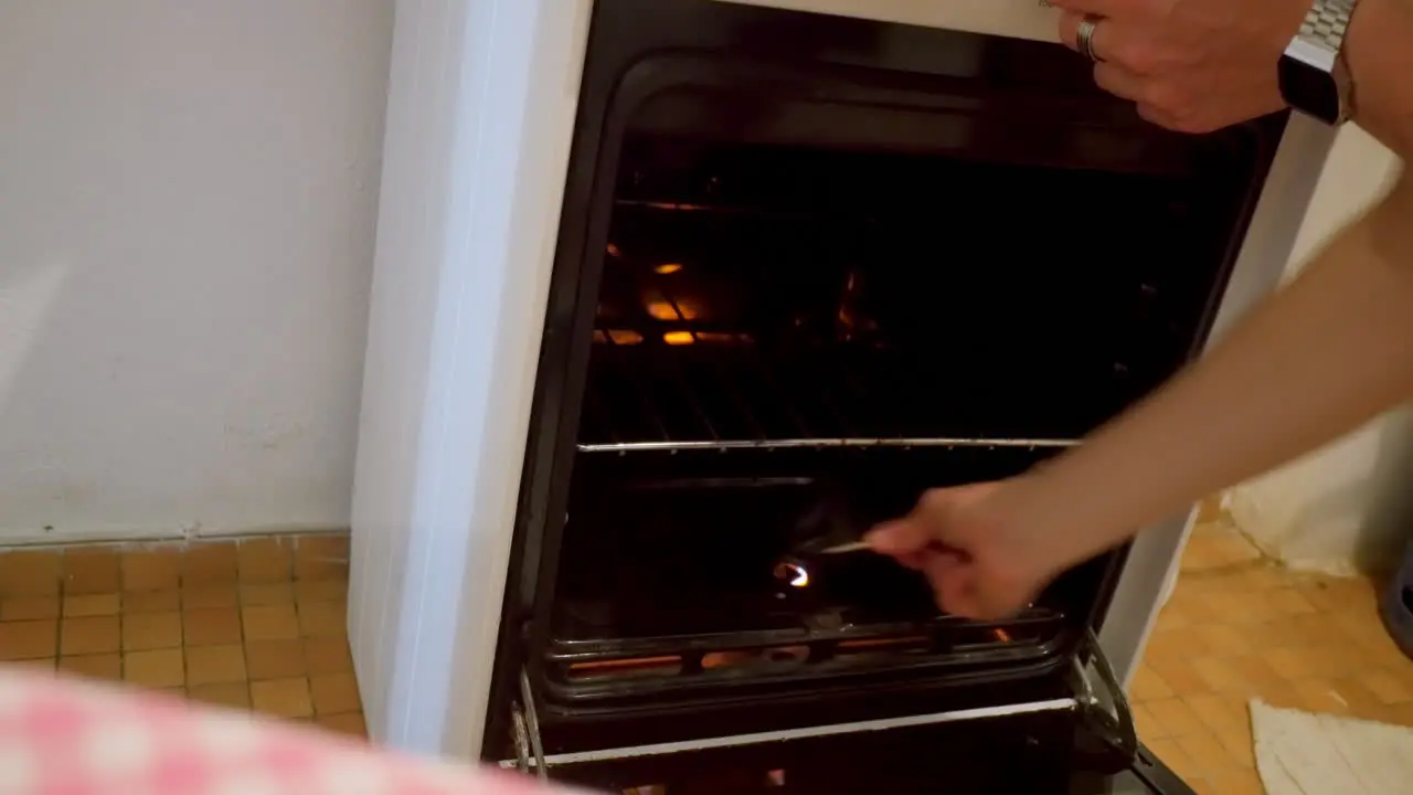 Turning on empty gas oven with matches