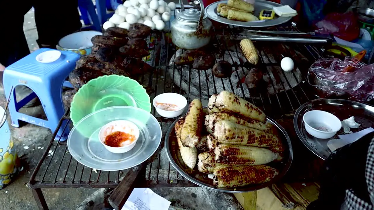 a shot of grilled corn grilled eggs and grilled sweet potatoes on a chilly afternoon