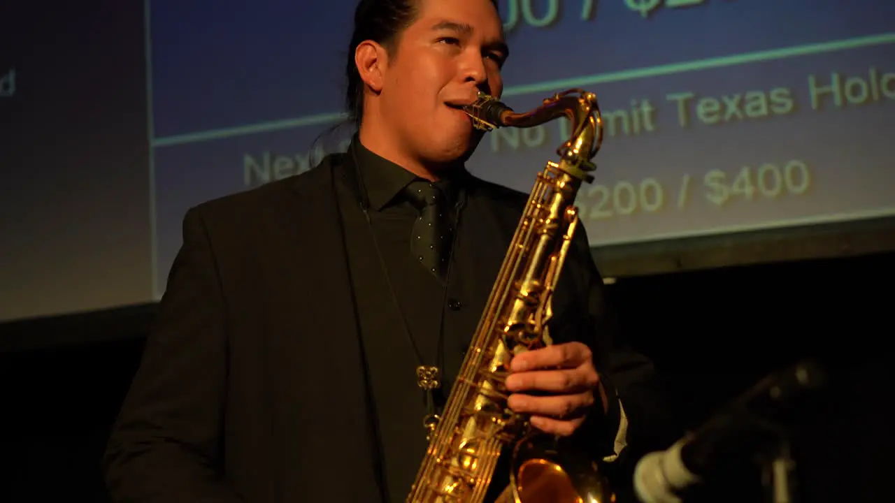 man playing saxophone at event