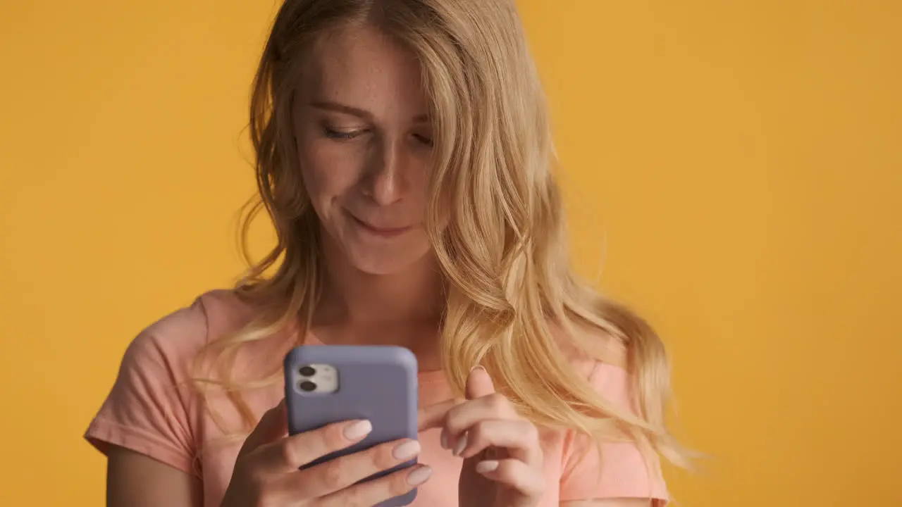 Caucasian woman scrolling on smartphone