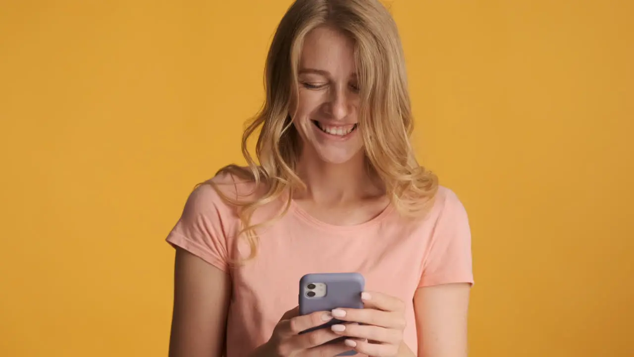 Caucasian woman using smartphone on camera