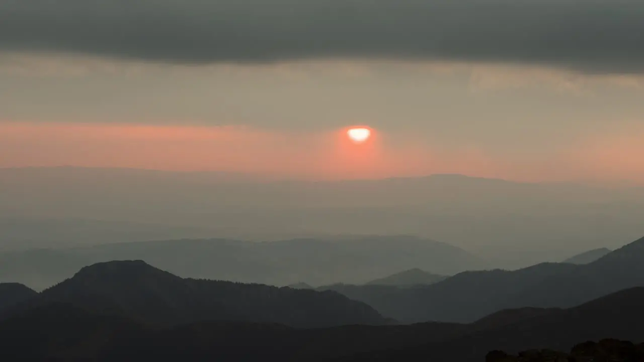 Unique alpine sunrise as sun disappears behind clouds misty conditions time lapse