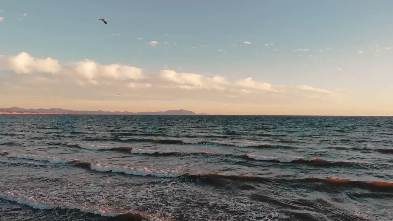 Aerial of splashing waves on the Mexican shoreline