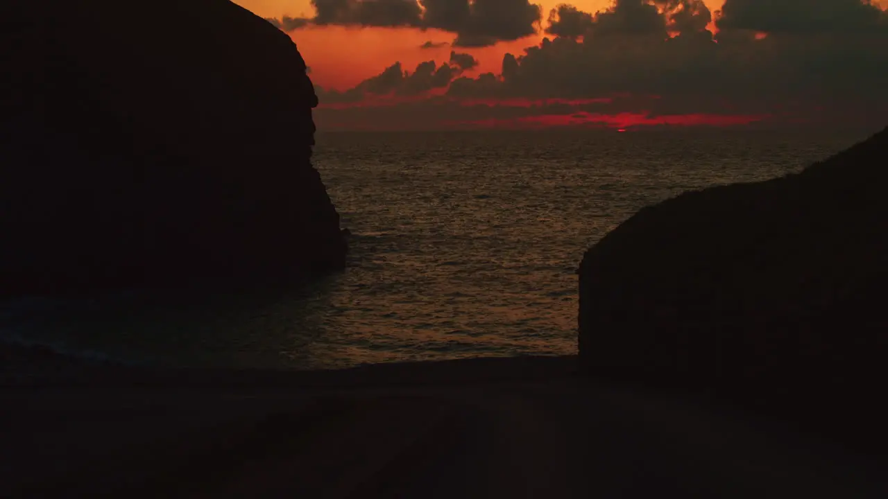 Dramatic Orange Sunset With Calm Ocean From Chapel Porth Beach In United Kingdom