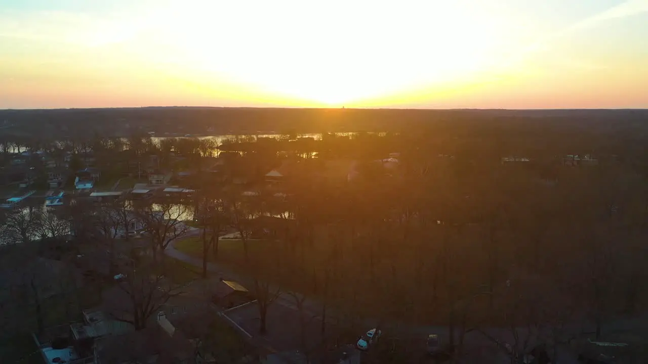 Beautiful Sunrise Over Body of Water Grand Lake O' the Cherokees In Midwest Oklahoma Looking Over Reservoir and Forest aerial drone shot