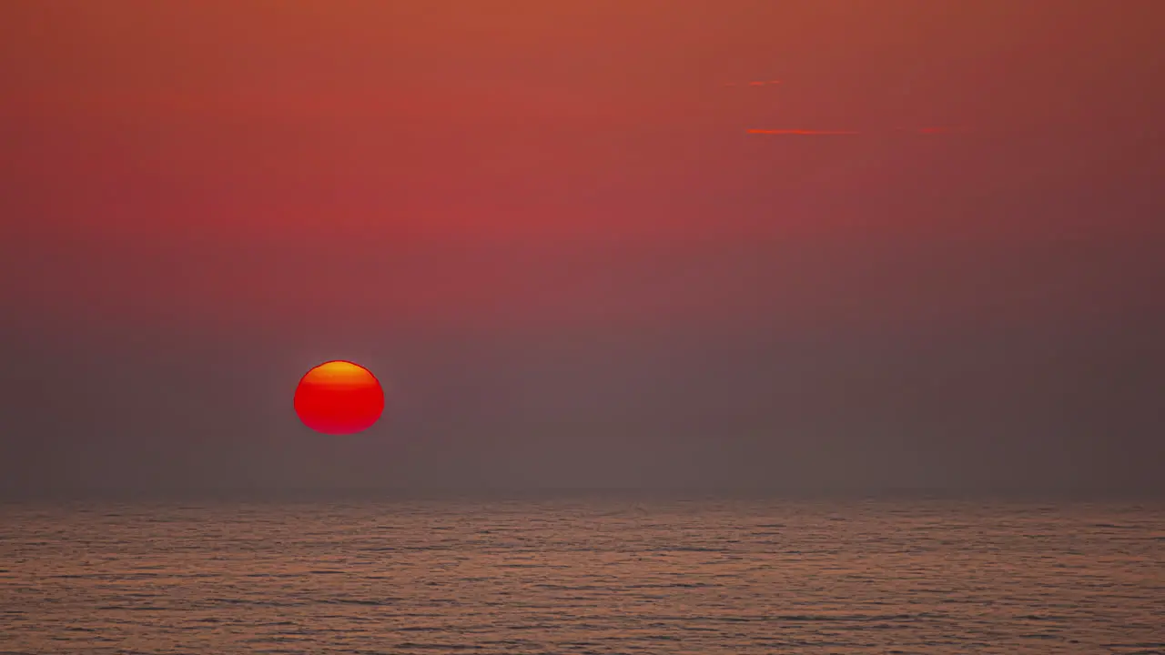 Beautiful sunset over the sea in timelapse during evening time