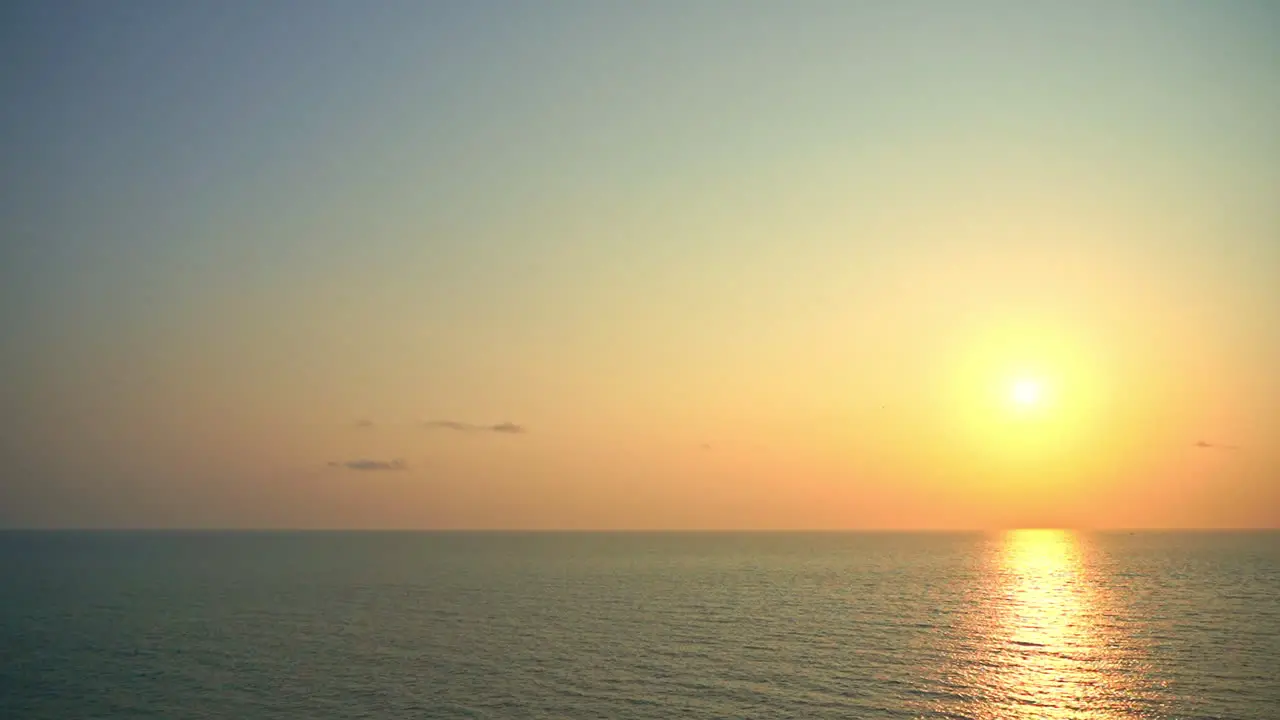 Breathtaking setting golden sun over sea