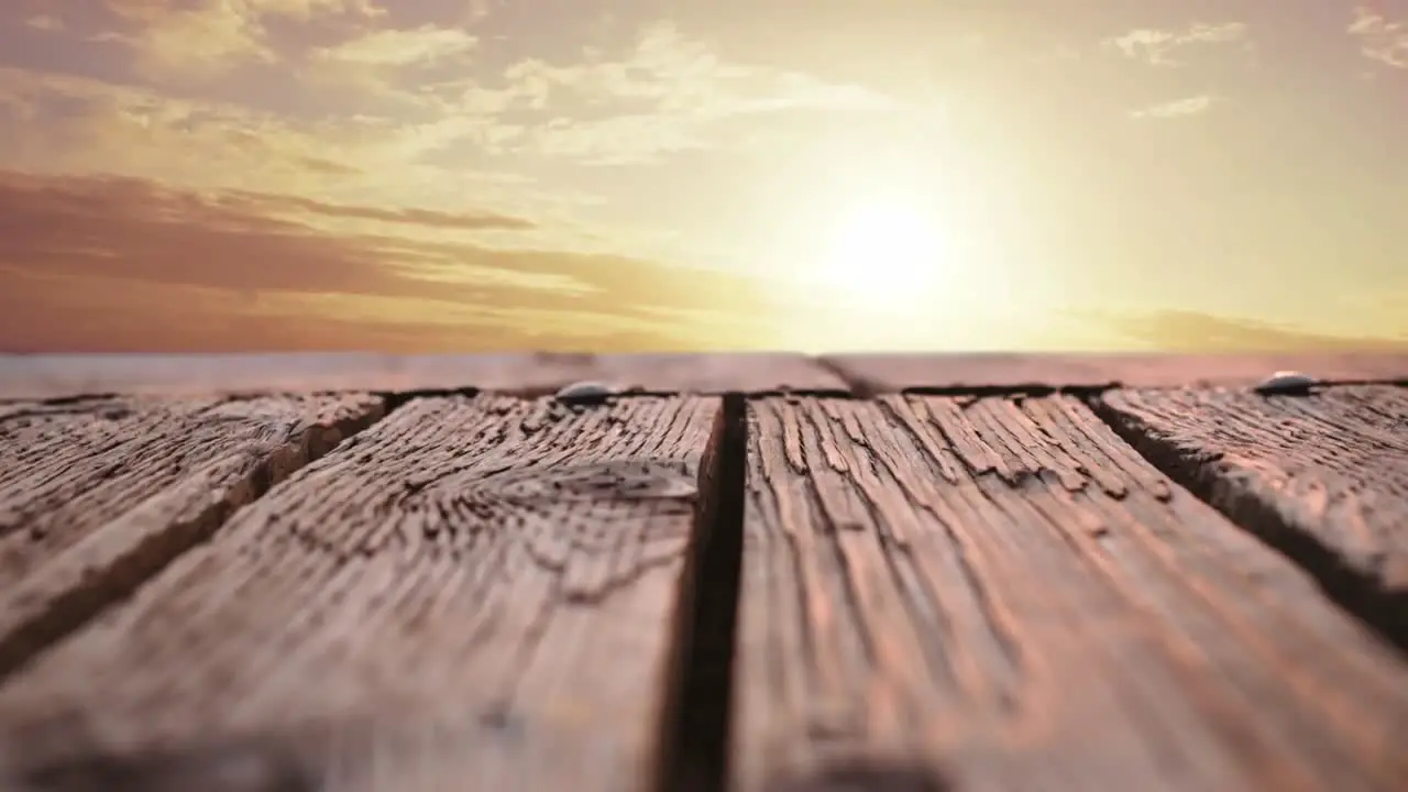 Wooden deck with a view of a sunset