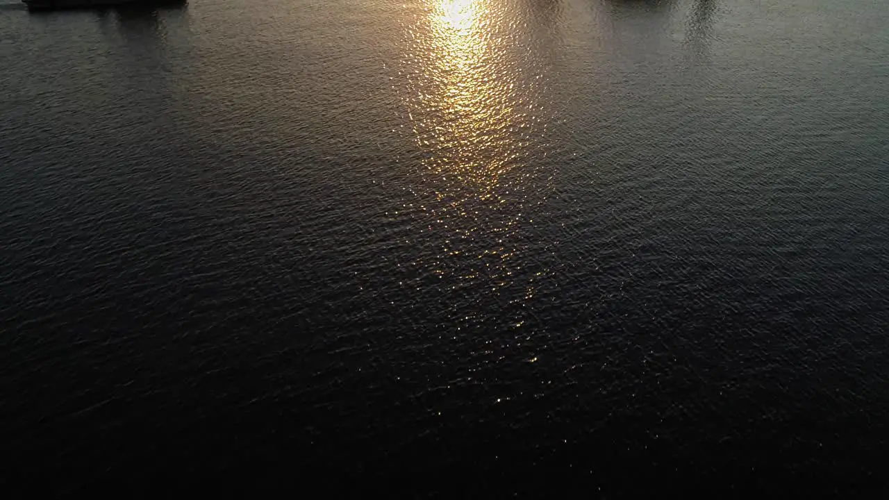 Tugboat And Hydraulic Equipment With A Golden Sunset And Reflection At The Baltic Sea In Darlowko Poland