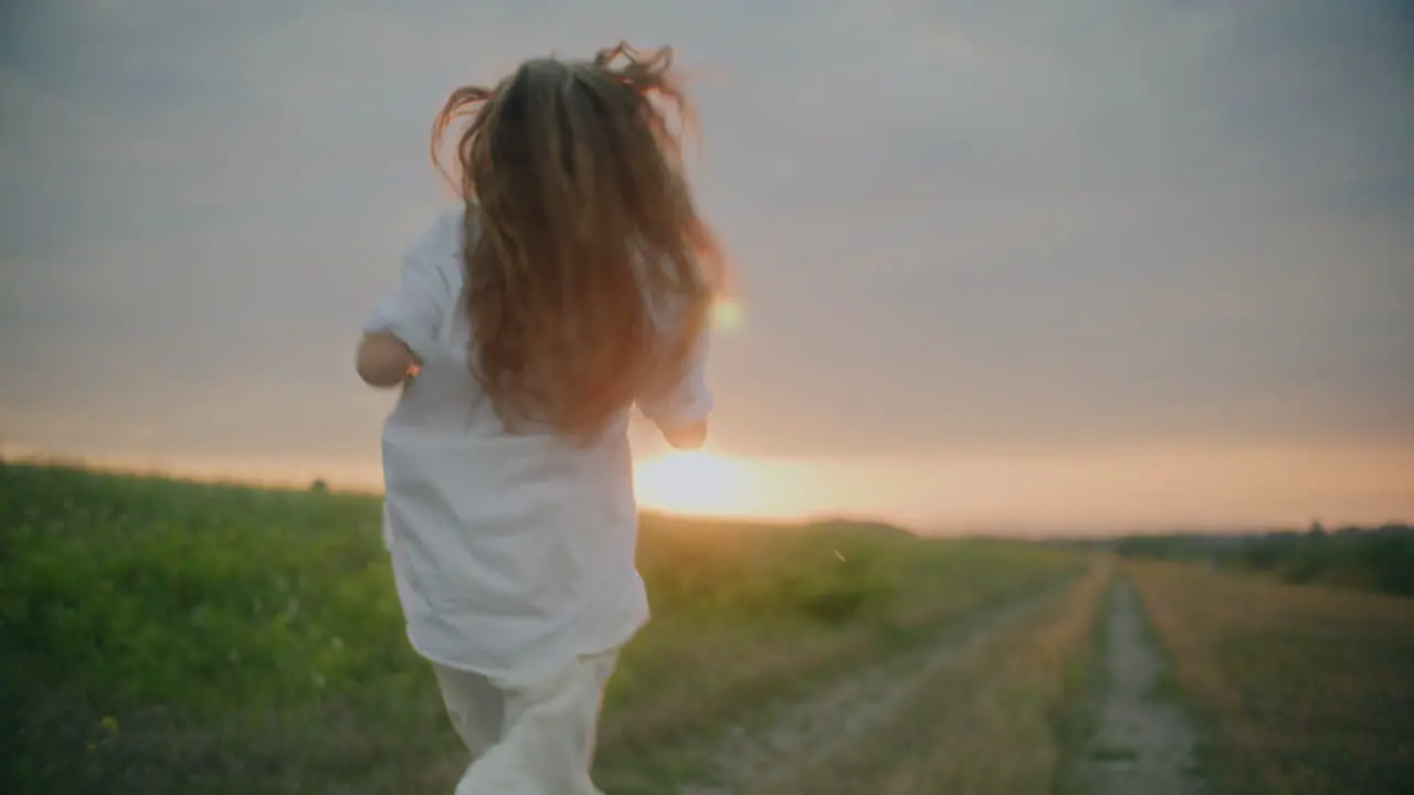 Joyful Woman Running Into Sun