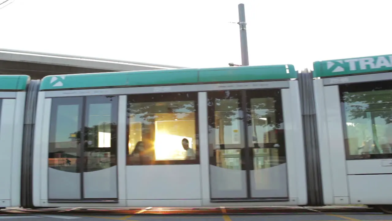 Tram is passing by at the sunset