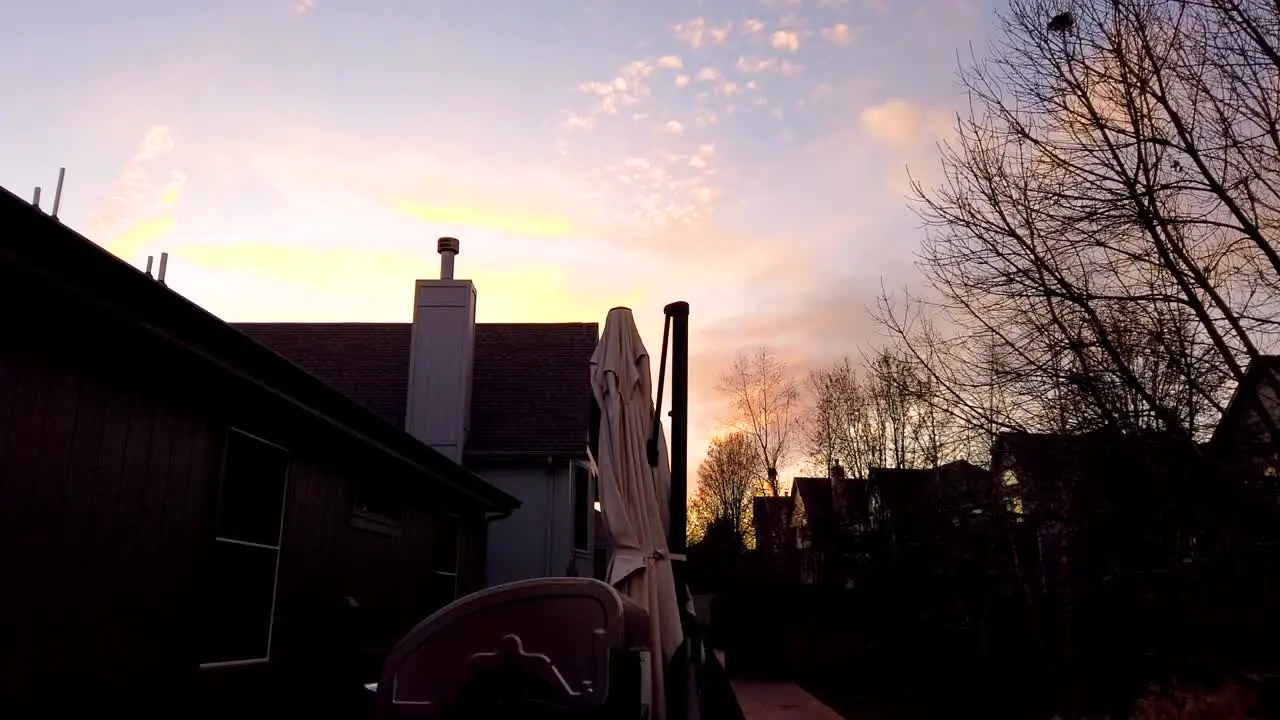 Sunset in the backyard of a house in a neighborhood timelapse