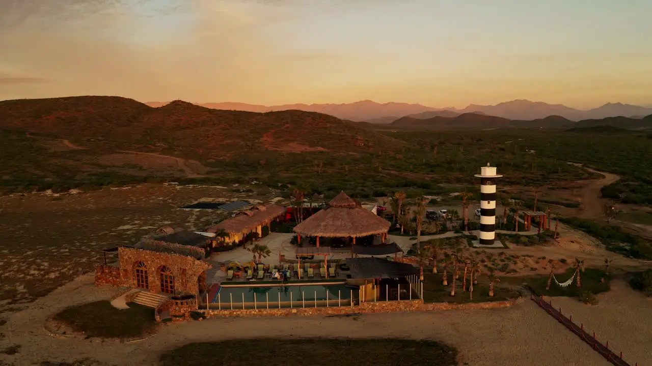 Establishing shot of a beautiful beach house at sunset