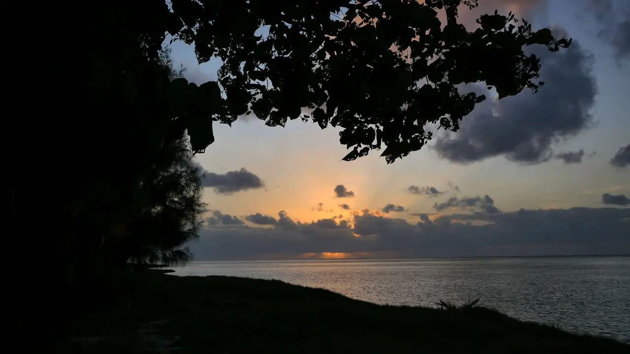 Aitutaki Sunset Framed With Leaves