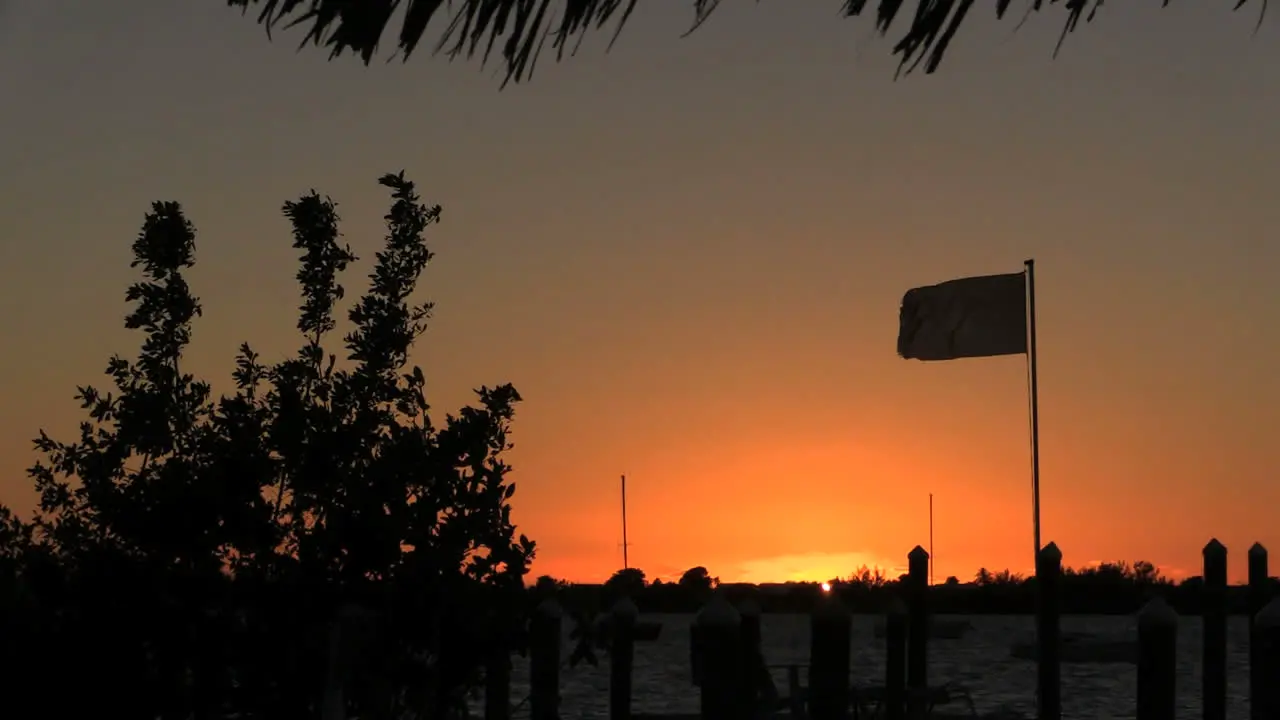 Florida Key Largo Sunset With Flag Blowing In Wind