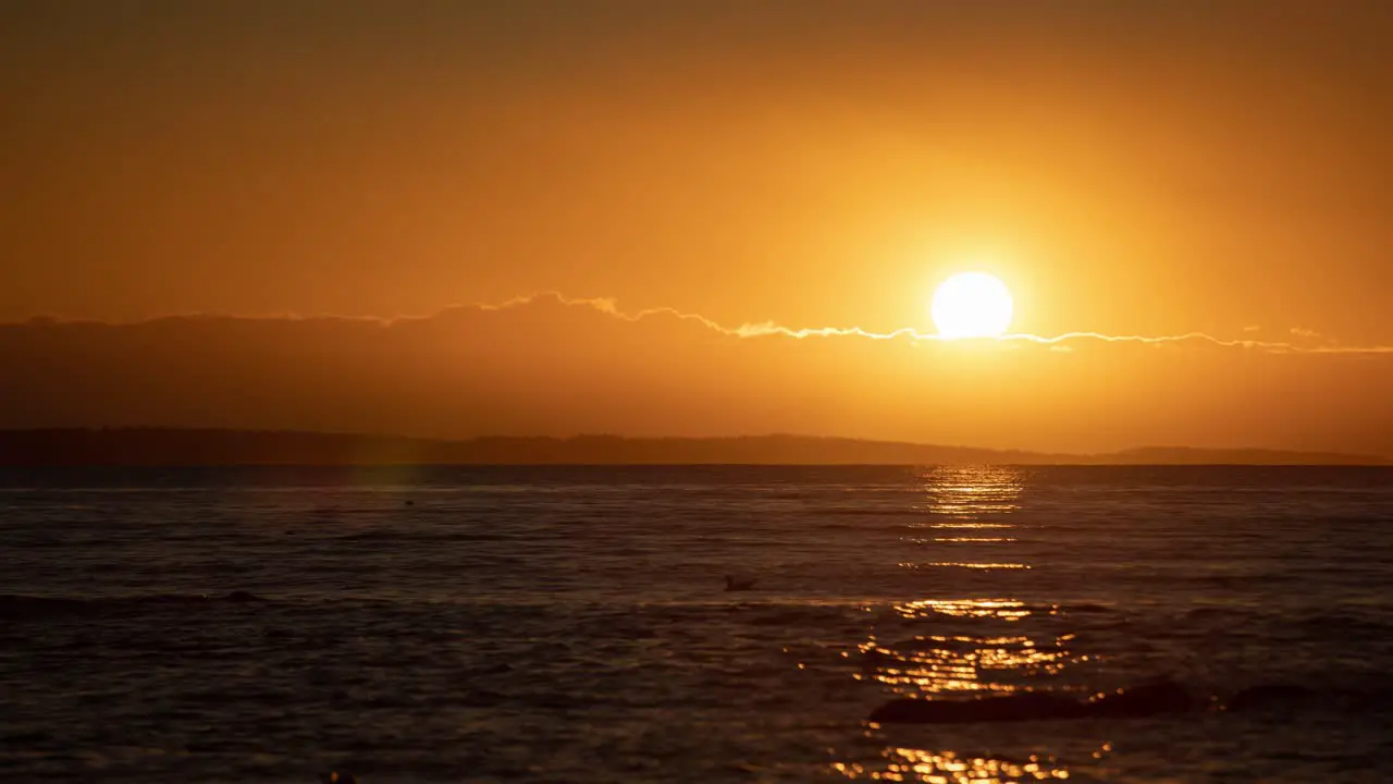 Time lapse video of rising sun trough the clods over Oslofjord in Southern Norway