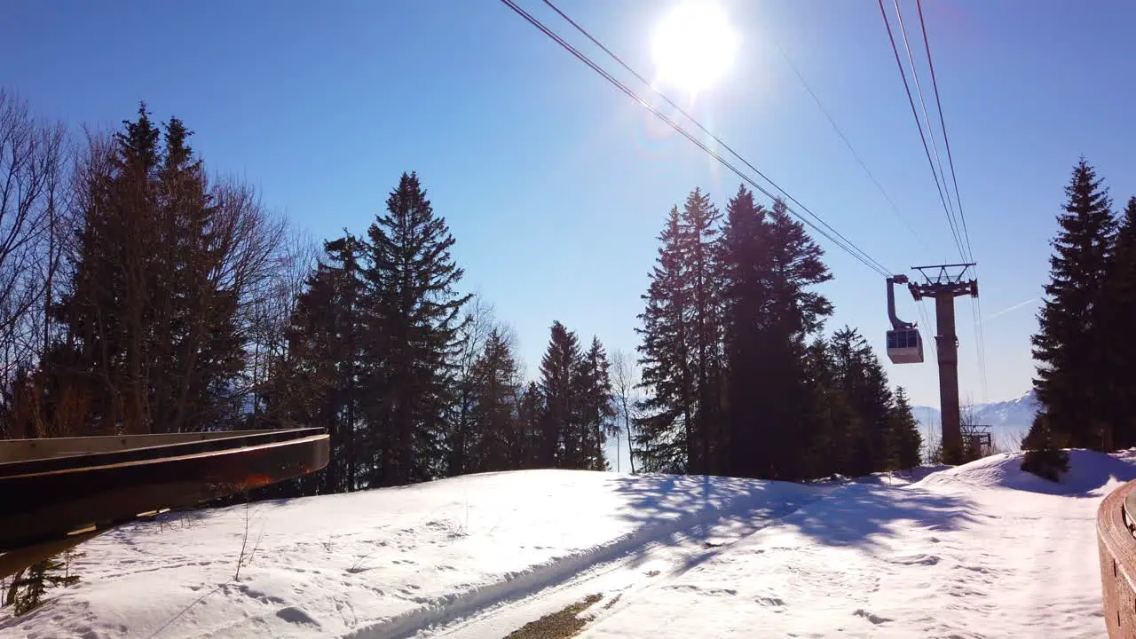 Ascending cable car in the snowy Swiss winter mountain wonder land