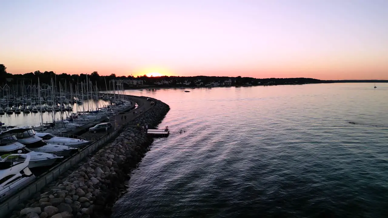 Swimmers swimming off platform in Sunset