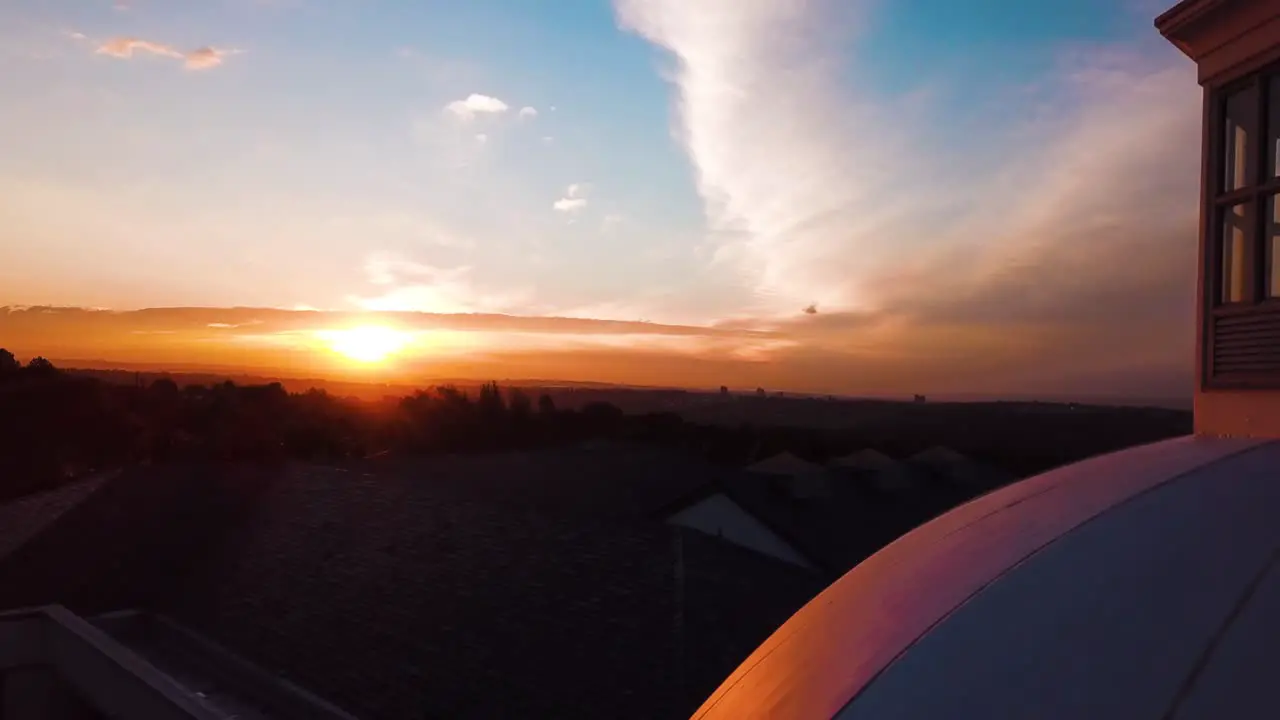 Beautiful 4K Aerial-Drone shot zooming into sunset with White House styled building in shot in Sandhurst Sandton