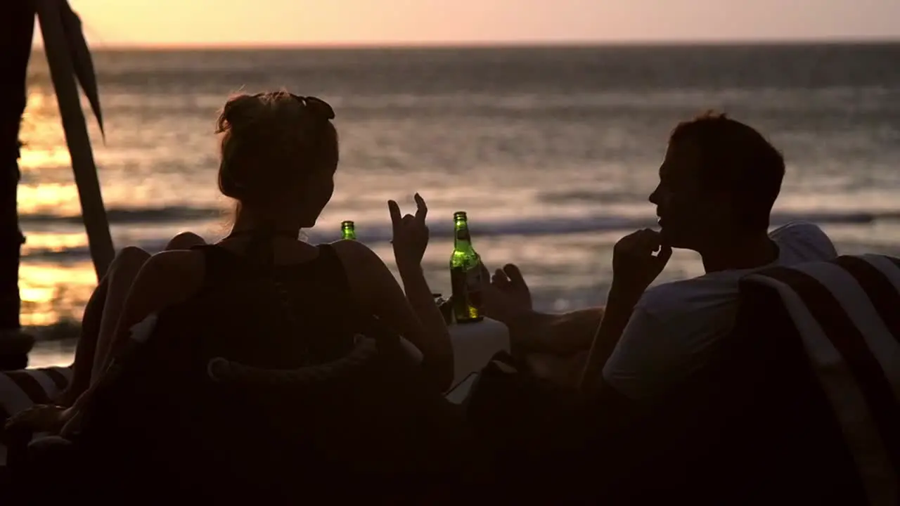 Man and Woman On Beach at Sunset