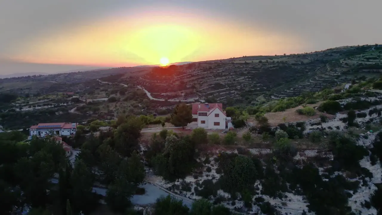 Aerial of a lonely house during sunset in Troodos mountains Cyprus