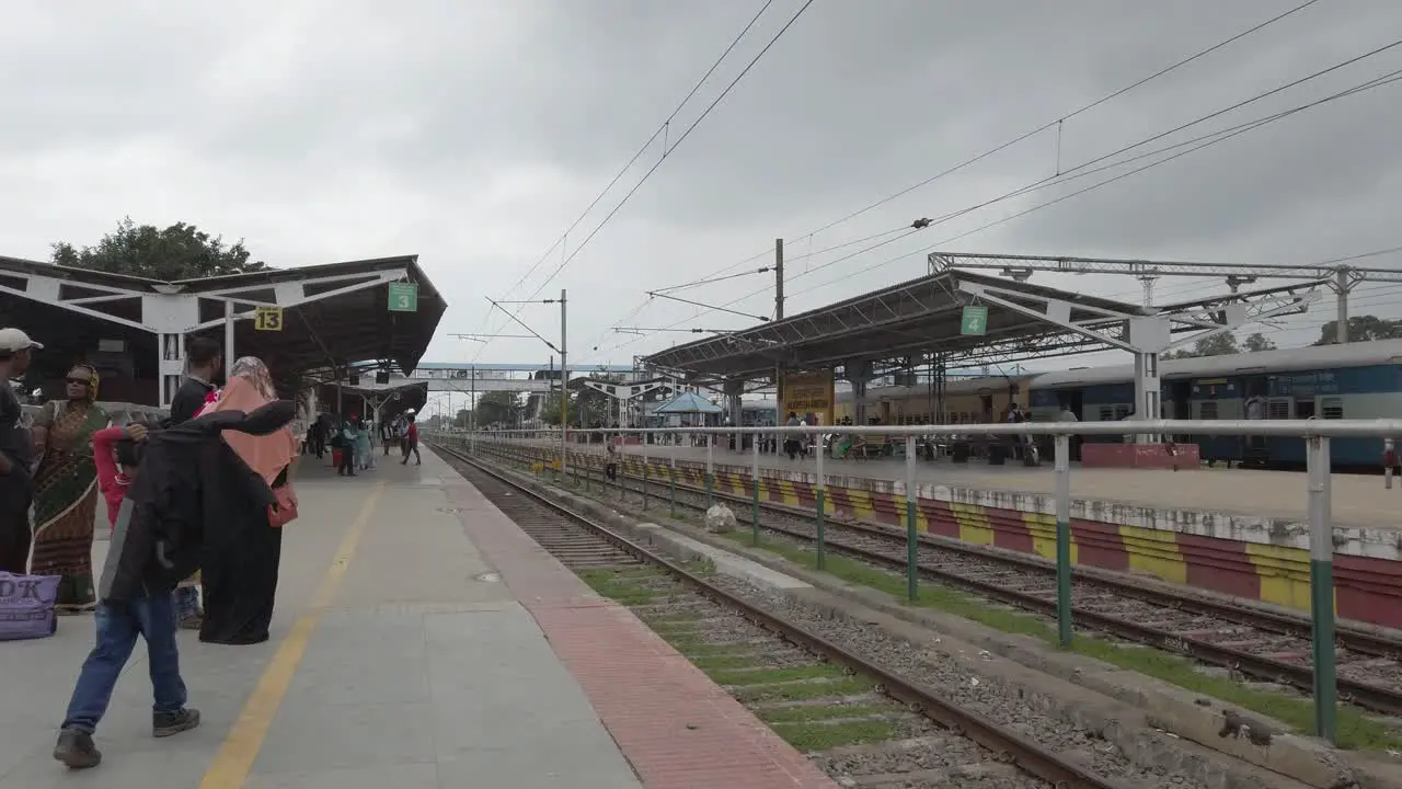 Jolarpettai Tamilnadu India March 17 2020 Wide angle panning shot of a nearly empty railway station due to corona virus threat on an overcast day 