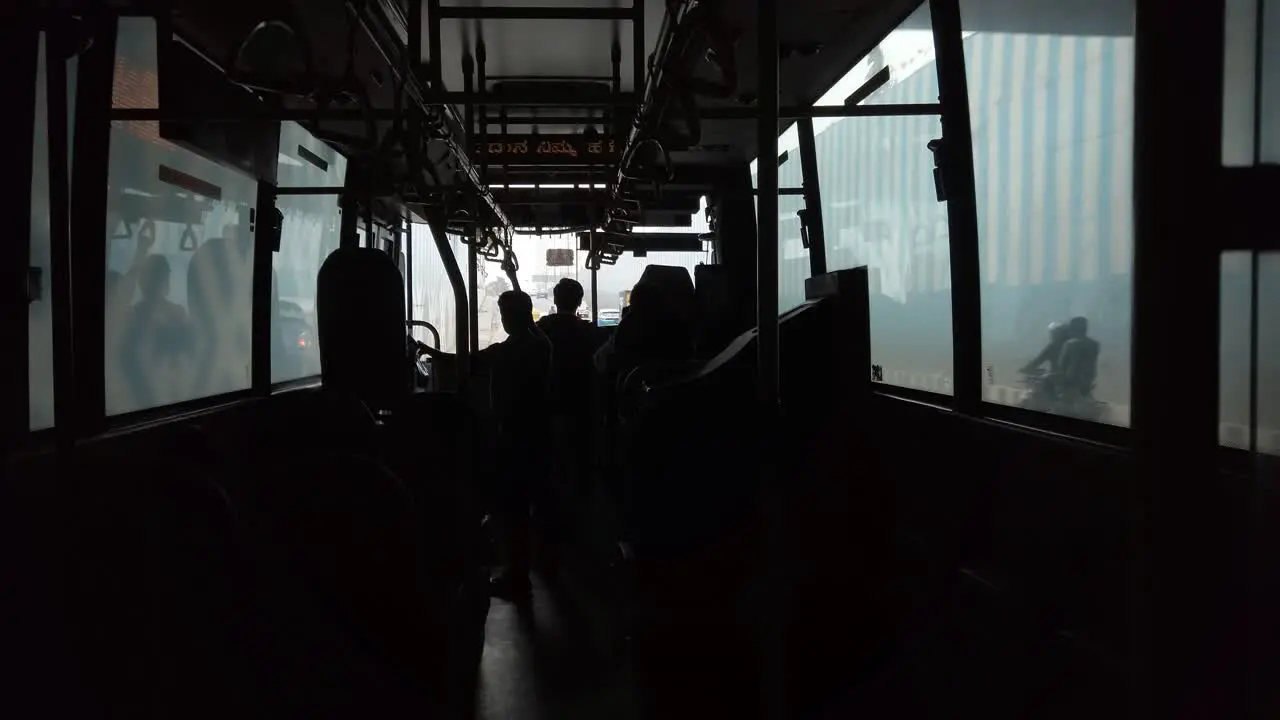 Wide angle shot of the inside of a public bus during day time less crowded due to corona virus fear