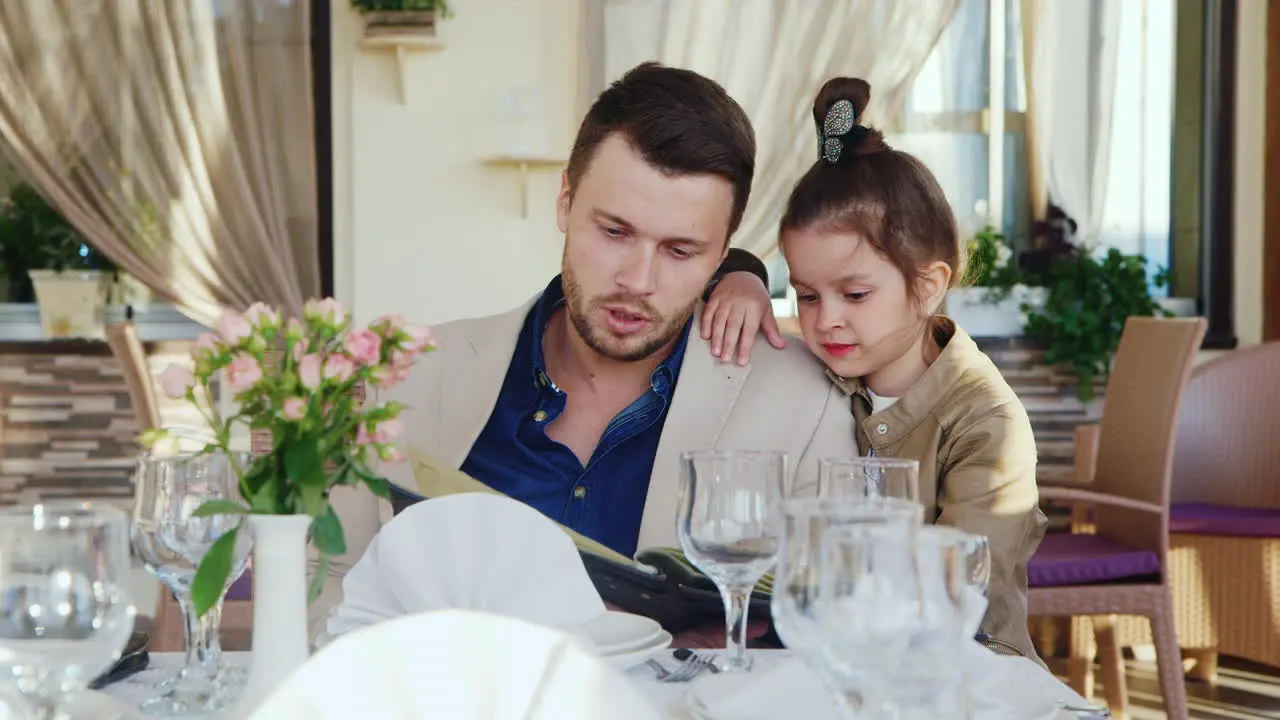 Father and Daughter in a Restaurant