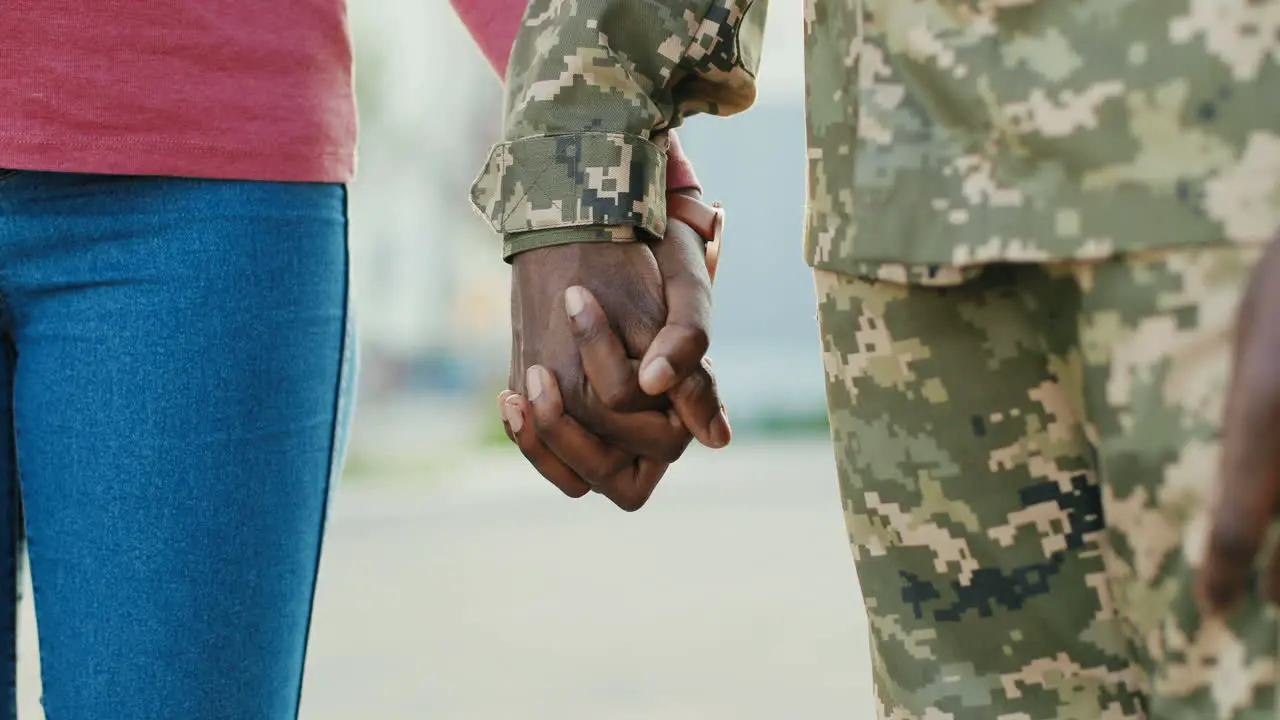 Soldier And His Girlfriend Hands Holding Hands