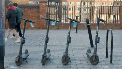 Medium Shot of Stationary Electric Scooters