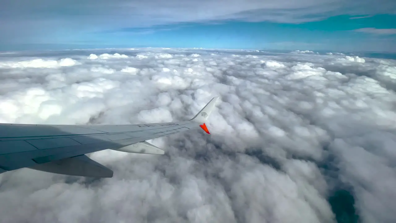 shot of window seat over clouds in Mexico city