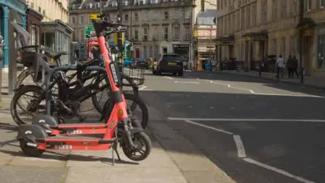 Medium Shot of Stationary Electric Scooters On Road Side