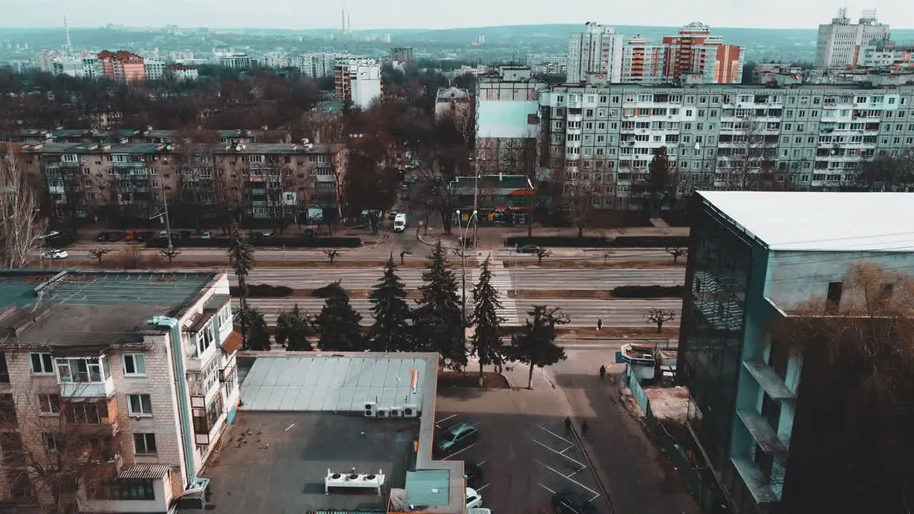 Flying over the buildings and the road in Chisináu Moldova