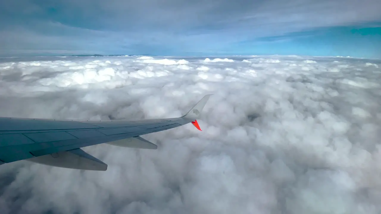 shot of window seat over clouds in Mexico