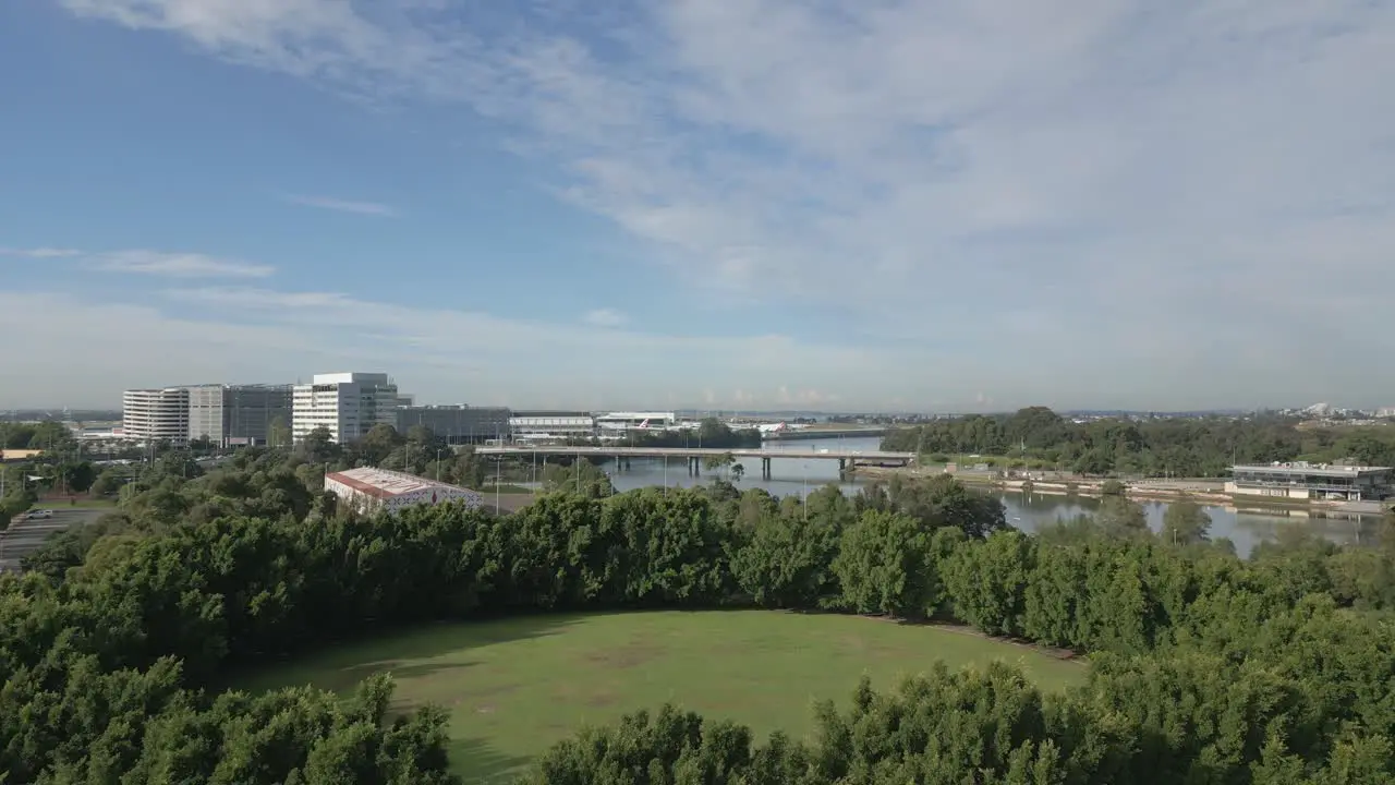 Ascending shot from the park reveals river and the bridge in the quiet suburban of Sydney