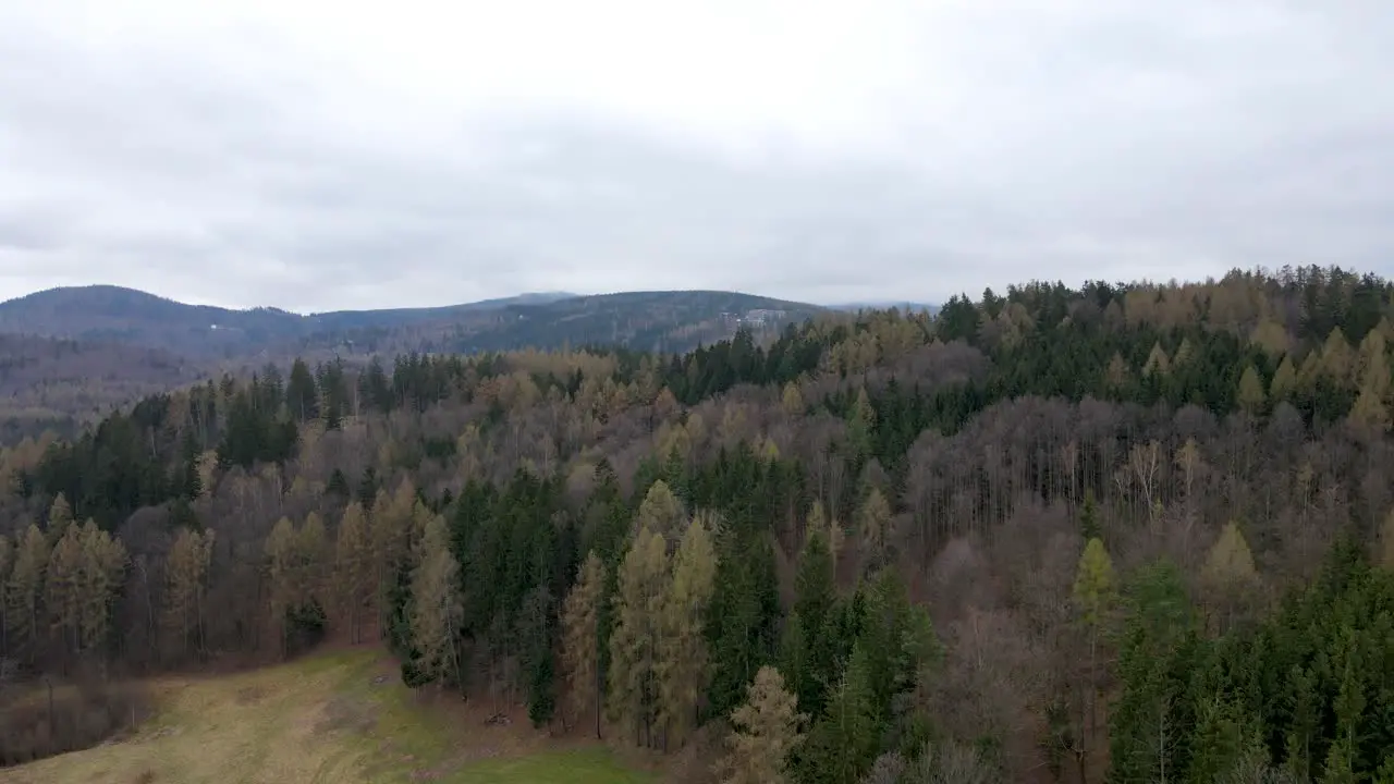 Aerial Shot Through The Mountains On A Cloudy Gray Day