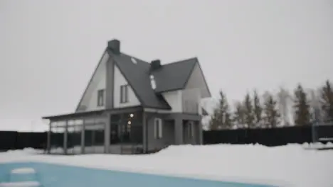 Person putting for sale banner on a house