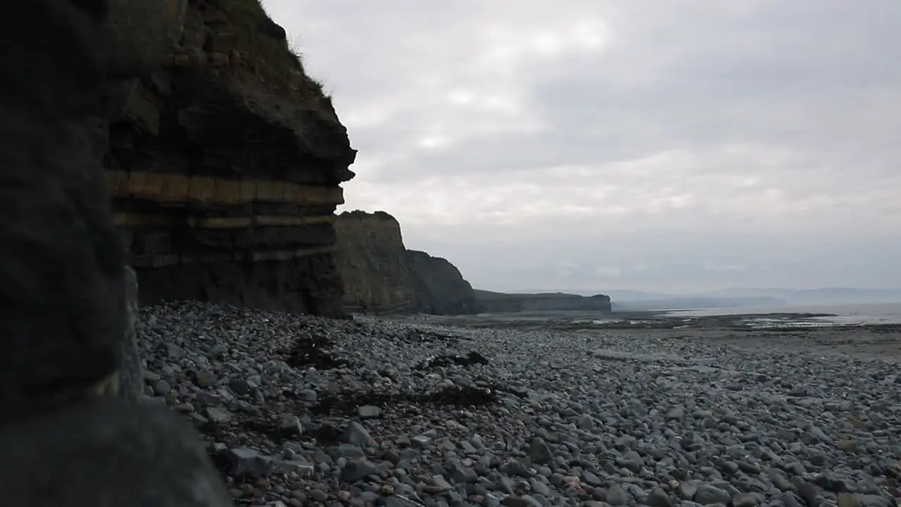 Stone beach in South of England surrounded by cliffs