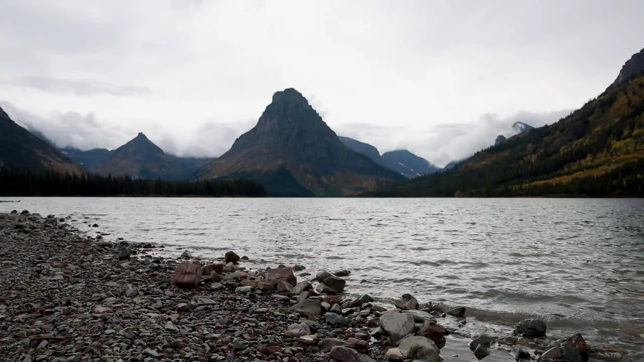 Two medicine lake in Glacier National Park with cloudy and windy conditions at the end of the 2022 season