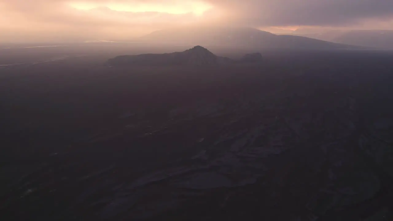 Mountain peak near sea at sundown