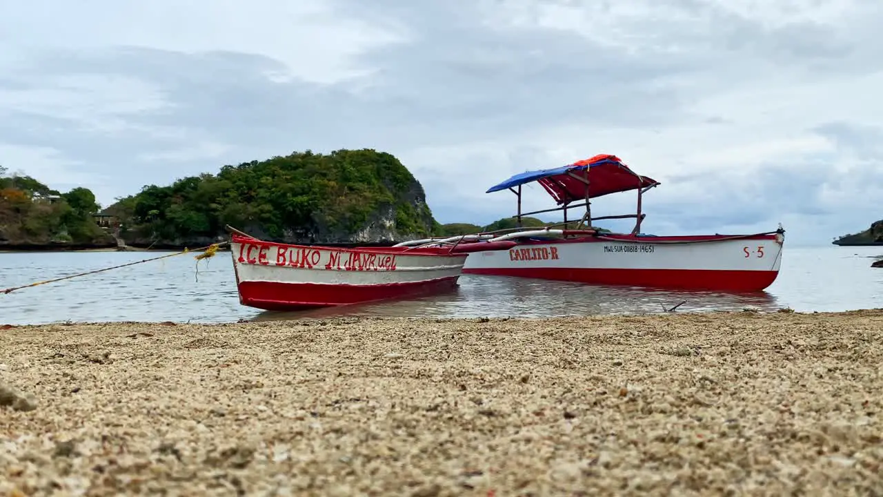 Two Philippine Bangka Boats On the Shore of a Sandy Beach