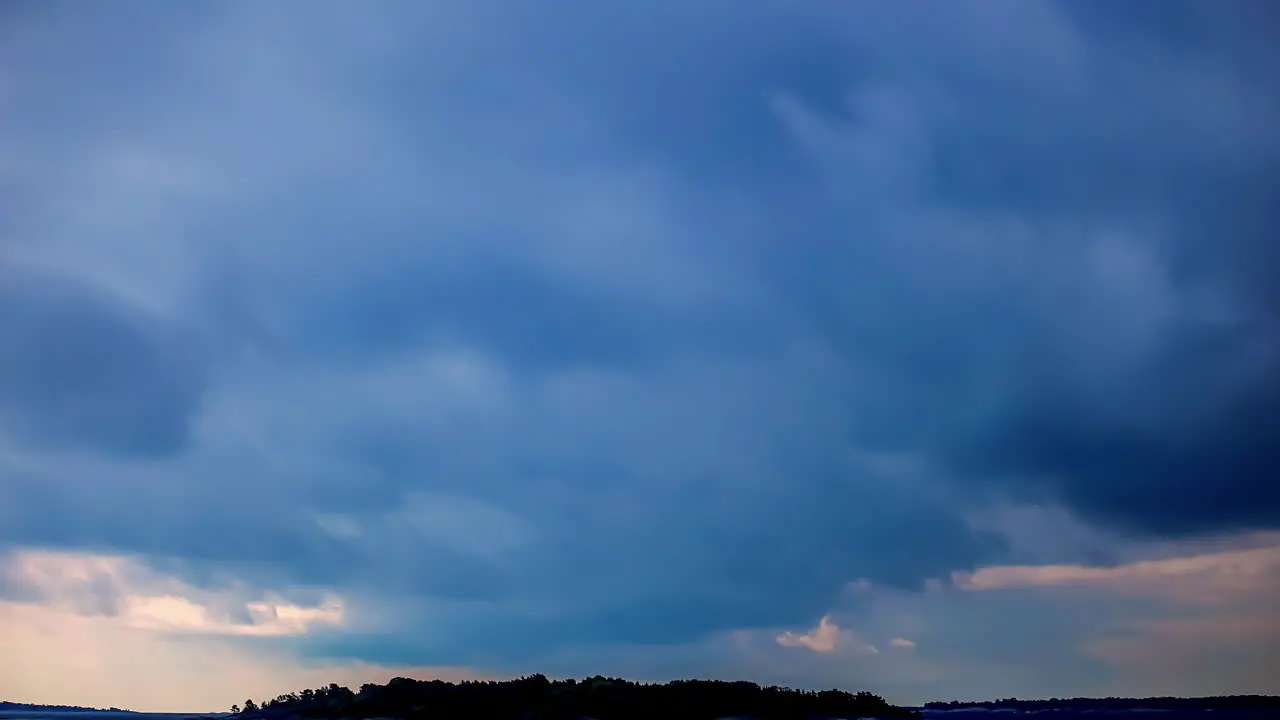 Wonderful blue sky and dark clouds moving time lapse