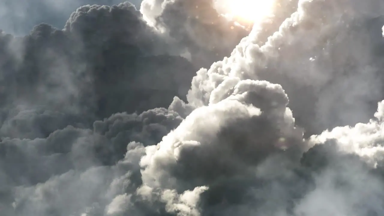 the sun was shining brightly against the thick dark cumulonimbus clouds