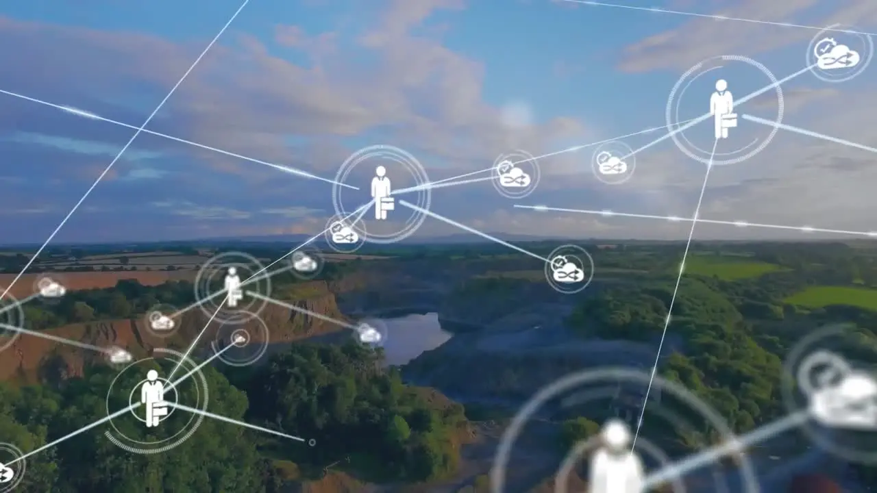 Animation of connected icons over aerial view of forest and lake against cloudy sky