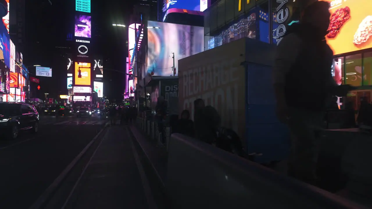 POV shot biking in middle of people at Times square night in Manhattan New York