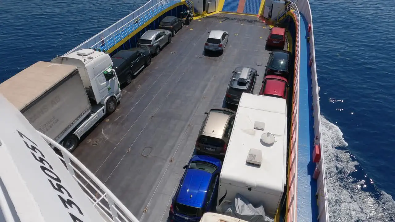 View Of Parked Cars Lorry And Camper Vans on Deck Of Ferryboat Crossing The Sea