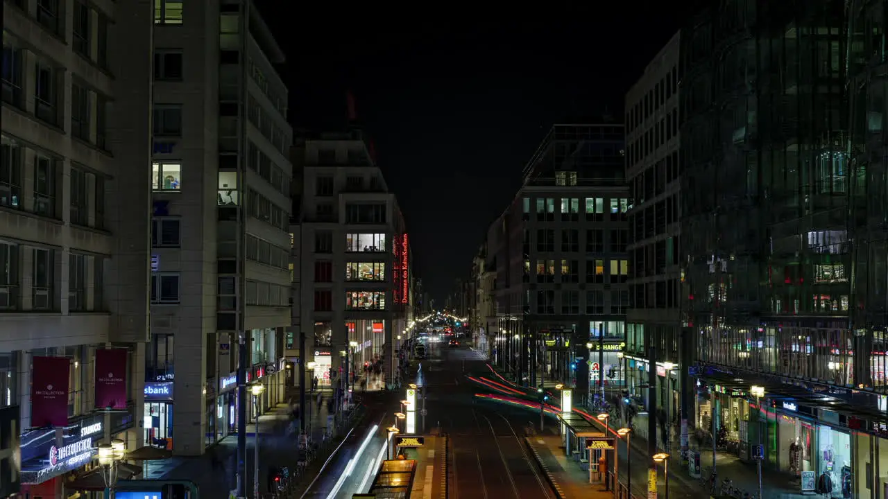 Busy Friedrichstrasse Berlin city street illuminated time lapse night traffic